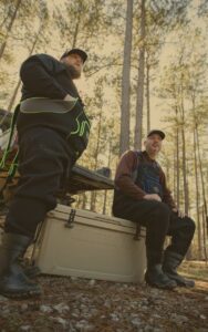 Men in ProSport outdoors hoodie and waders on mammoth cooler